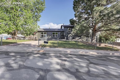 Split level home featuring driveway