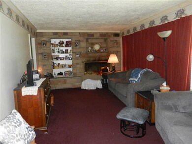 Living room with fireplace and built in shelves.