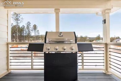 Wooden deck featuring a grill