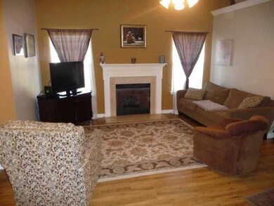 Open living room that is the central part of the house and is newly painted.