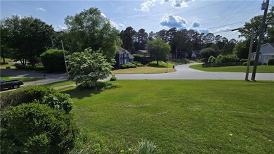Surrounding community with a yard and a residentia