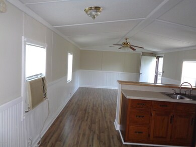KITCHEN AREA LOOKING INTO LIVINGROOM