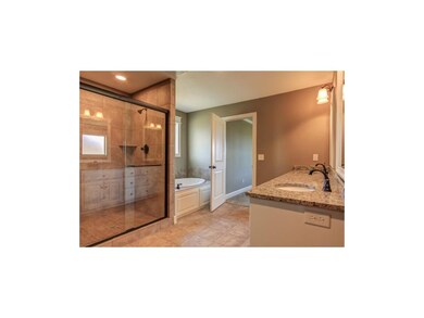 Lots of space in this Master Bath with granite and
