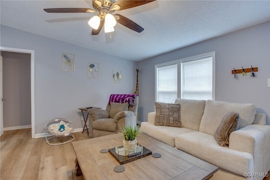 Living room featuring light wood finished floors,