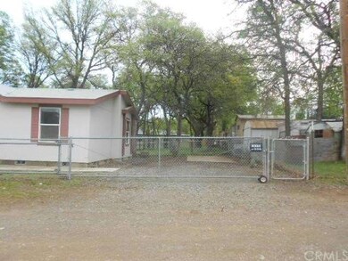 to the right of the home, nice chain link gate tha