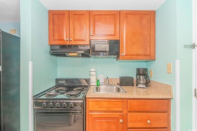Kitchen with sink and black appliances