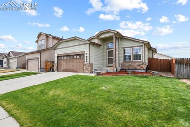 View of front of property featuring a garage and a