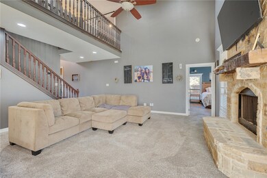 Carpeted living room with a high ceiling, ceiling