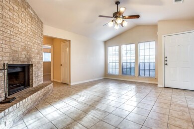 Unfurnished living room featuring ceiling fan, li
