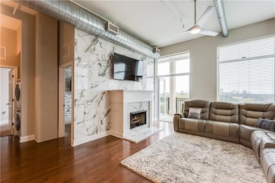 Living area featuring dark wood finished floors, a