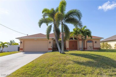 View of front of property featuring a garage and a