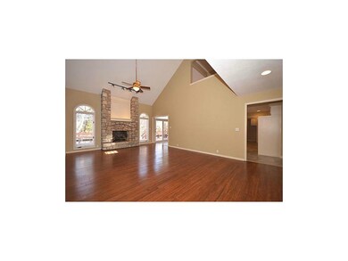 Spacious and inviting living room with stone firep
