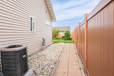 Paved walkway to backyard