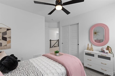 Bedroom featuring carpet flooring, a closet, and ceiling fan