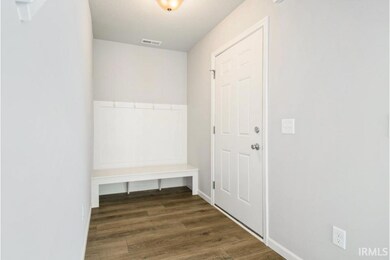 There is a built in storage bench in the foyer.