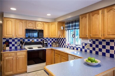 Stylish kitchen with tile backsplash...