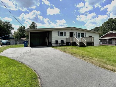 Good size carport with 2 doors to the house