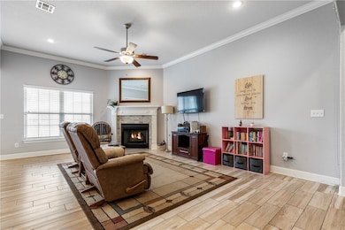 Large living room w/gas fireplace.  Crown molding