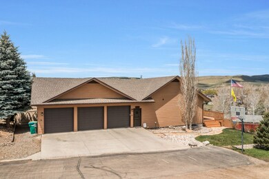 View of front of house with an attached garage, ro