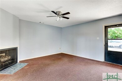 The living room is spacious and has a gas fireplac