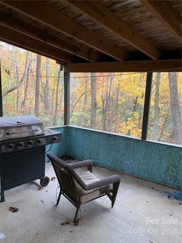 Screened porch overlooking the private backyard.