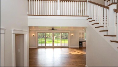 Photo of a similar home showing open foyer entry