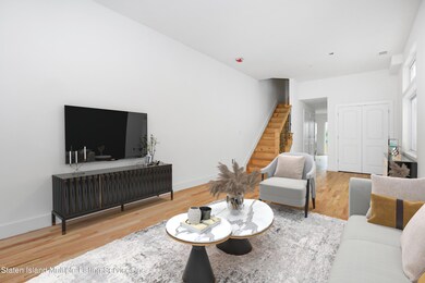 (2) LIVING ROOM STAGED