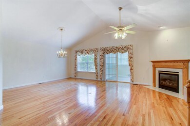Living/Dining Room with gas fireplace and vaulted ceiling