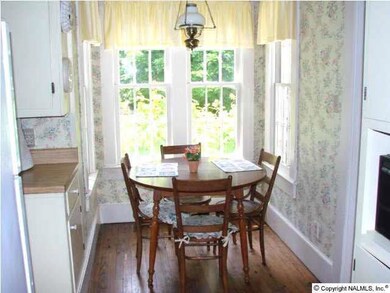 Brealfast area overlooks rear yard.