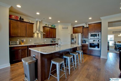 Gorgeous granite counters in this open concept kitchen.