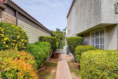 Interior Courtyard with Brick Walkway and Lush Lan
