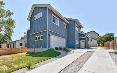 View of property exterior featuring a yard, a gar
