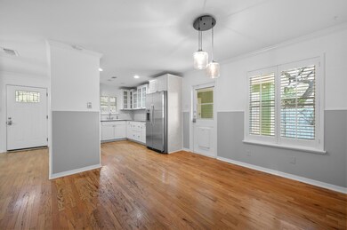 Kitchen featuring stainless steel refrigerator wi