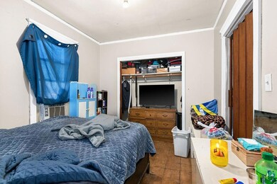 Bedroom with a closet and crown molding
