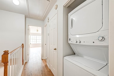 Stacked washer and dryer.
The hallway leading to