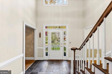 Foyer featuring stone tile flooring
