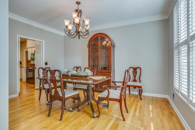 DINING ROOM FEATURES: Sand and seal hardwood floors, China closet, Doors to open to kitchen , New light, New paint Crown molding, Custom transom cut glass, Oil rubbed bronze hardware  Plantation shutters 