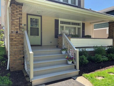 This home has a large front porch for relaxing, a manageable size yard and garden beds planted with perennials.