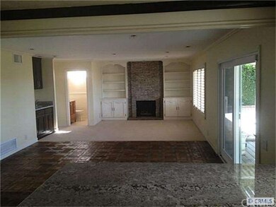 View from kitchen into large family room with cust