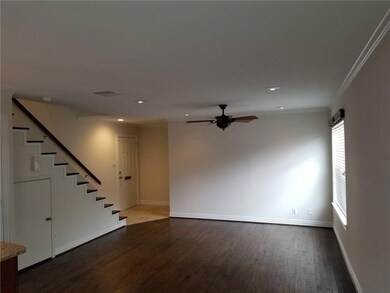 Large living area with custom ceiling fan that mat