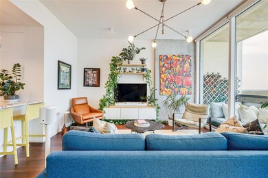 Living room featuring wood finished floors and ba