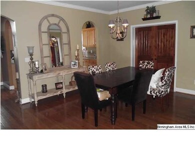 The formal dining room with its hardwood floors, 9