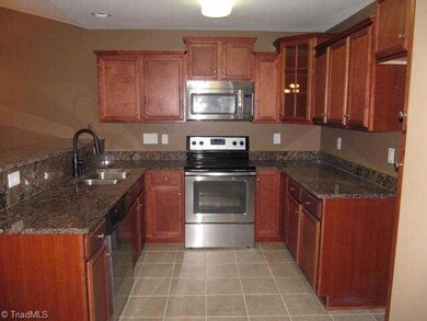 Kitchen. Granite Countertops, Stainless Appliances, Ceramic Tile Floor