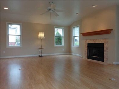 Family Room. A gas fireplace and lots of natural l