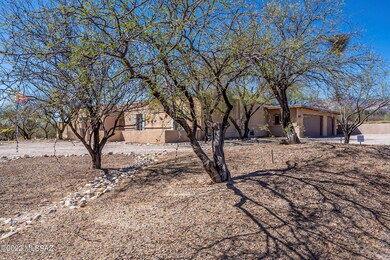 Surrounded by mature mesquite trees.