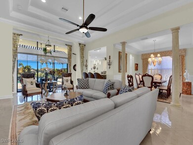 Tiled living room featuring ornate columns, orname