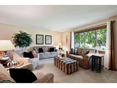 Spacious living room with oversized window looking