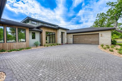 View of front of property with decorative drivewa