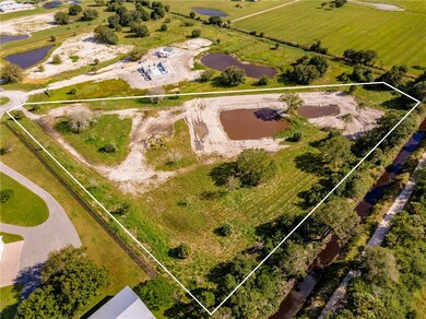 Overview of rural landscape with a large body of water and property boundaries highlighted