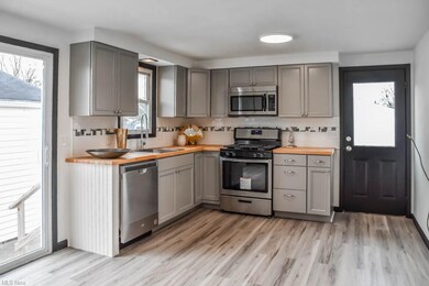 Brand new kitchen with stainless steel appliances.